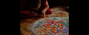 Lamayouro, Leh district, India. July 2017. Tibetian monks constructing mandala from colored sand in Tibetan Buddhist monastery. Sand mandalas transmit positive energies to the people who view them.